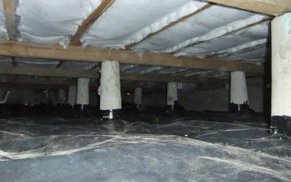 Ground moisture barrier sealed around subfloor piles